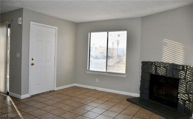  living room with light tile patterned floors, a