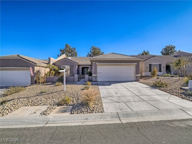 Ranch-style house featuring a garage, stucco sidin