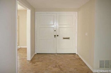 Wide Foyer with Tile Flooring