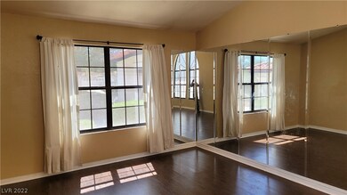 Front living room with large window and mirror acc