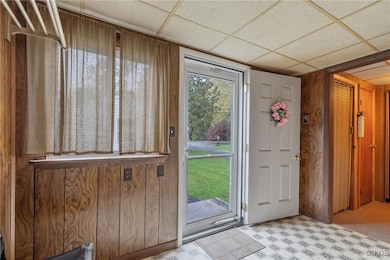 Turning from the front door, we can head into the rest of the house. Around the corner ahead are double closets for jackets, boots, and other storage.