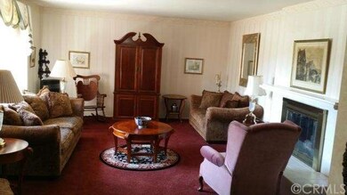 Spacious formal living room with fireplace