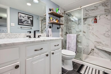 Bathroom featuring tile patterned floors, vanity, 