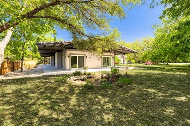 Back of property with stucco siding, a patio, and