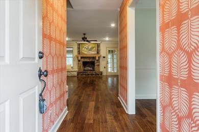 Foyer entrance with dark hardwood / wood-style flo