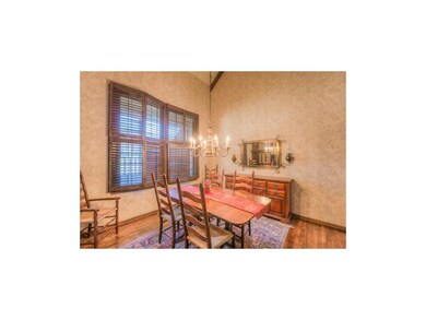 Harwood floors and vaulted ceiling in formal dinin