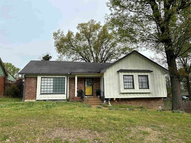 View of front of property with a front lawn