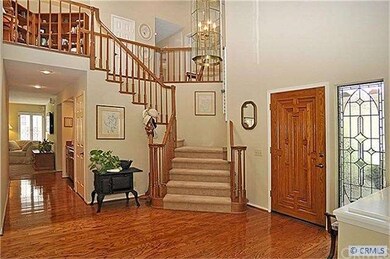 Dramatic entry with high ceilings and polished har