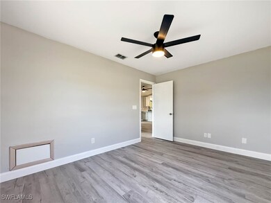 Spare room with ceiling fan, wood finished floors,