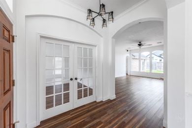 The combination of the stylish glass French doors and the strategic location of the office creates a harmonious and functional space, perfect for both professional pursuits and hosting gatherings.