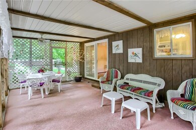 Screened in porch is accessible from the dining ro