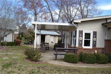 Covered Patio and Also the 2nd Storage building with fountain sink outside