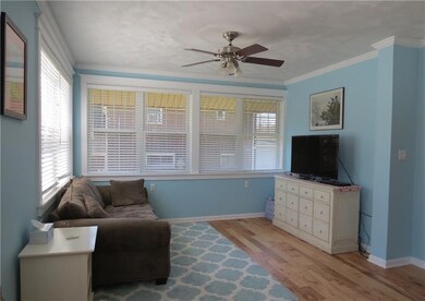 THE WINDOWS SURROUNDING THE LIVING ROOM ALLOW THE 