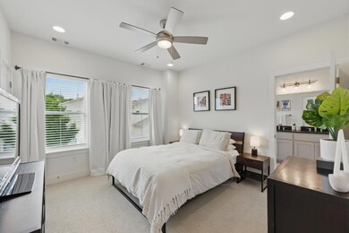 Bedroom featuring baseboards, light colored carpe