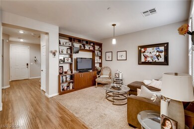 Living room with built in entertainment center.