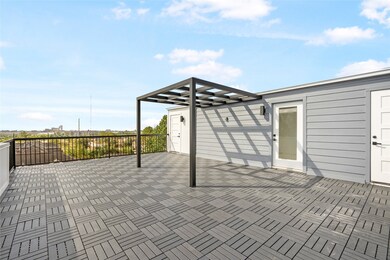 This is a spacious rooftop terrace with modern dec