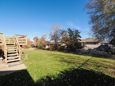 Fenced backyard with stairway and a patio area