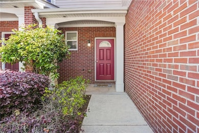 Entrance to property with brick siding