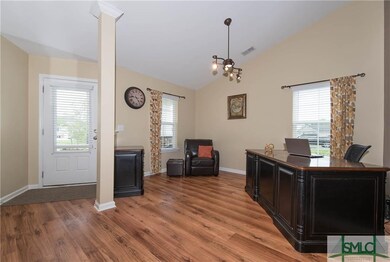 Foyer entryway opens to a flex space which can be 