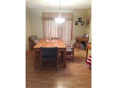 The wood laminate continues on to the dining area,