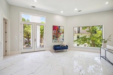 This elegant entrance features a bright, open spac