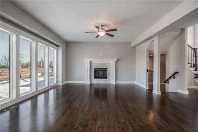 Gorgeous living room with hardwood flooring and cu