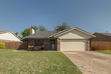 View of front of house featuring a garage, concret