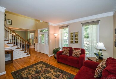Living room with wood floors and crown molding