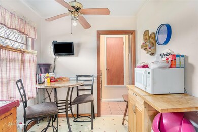 Dining area featuring ceiling fan, ornamental mold