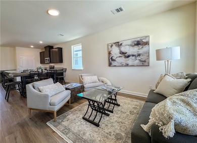 Living room featuring recessed lighting, visible v