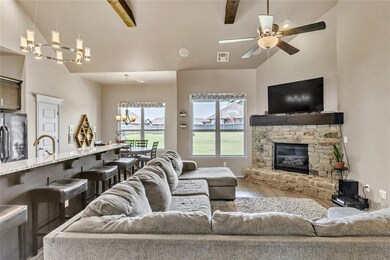 Living room featuring beam ceiling, light hardwood / wood-style floors, and high vaulted ceiling