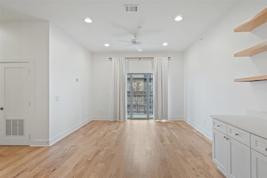 Unfurnished dining area with ceiling fan, light w