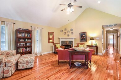 Spacious living room with vaulted ceiling.