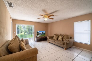 Living room with sliding glass door for backyard a