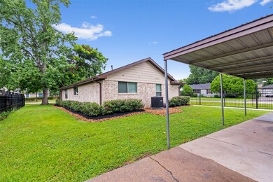 Angled view of the home with freshly landscaped fr