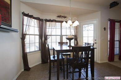 Tile floors continue into the sunny Breakfast Nook