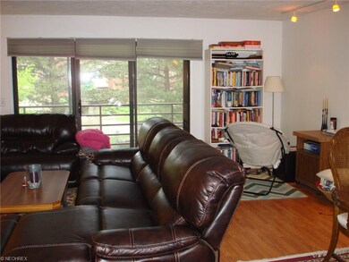 Large livingroom has laminate wood floors, enclose