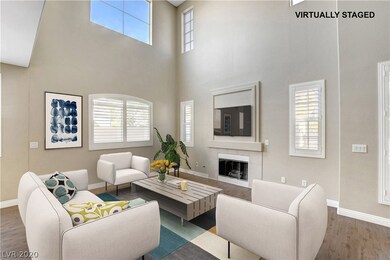 Spacious living room with vaulted ceiling and fire
