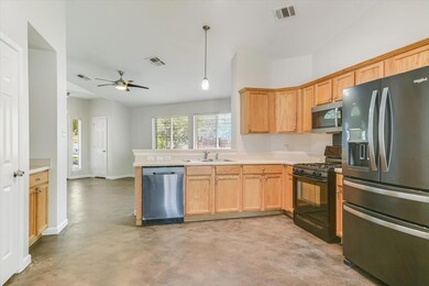 Kitchen featuring appliances with stainless steel