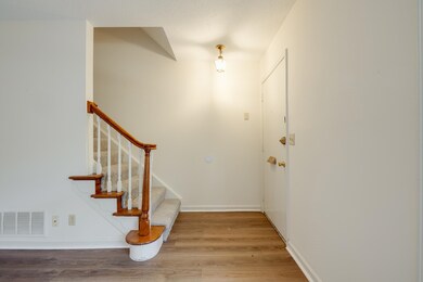 Entryway featuring light wood-style flooring and stairway