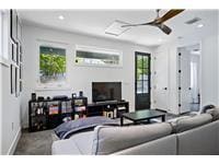 Living area featuring recessed lighting, baseboar