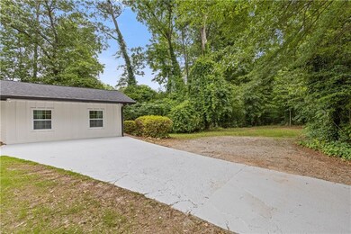 View of patio / terrace featuring concrete driveway