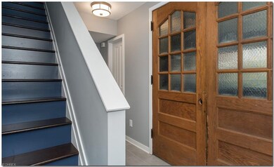Hallway at the Front and Garage Door entries with 