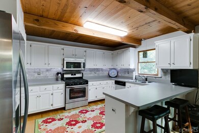 This kitchen has a new backsplash and all new stai