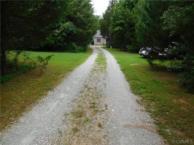 Driveway leading to home, home sits off Three Brid