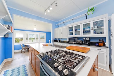 Kitchen features a gas stove and plenty of cabinet space