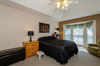 Master Bedroom Suite with Coffered Ceiling and Bay