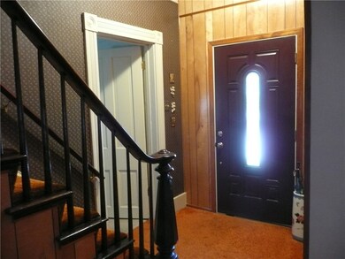 LARGE ENTRY FOYER THAT OPENS TO THE DEN AND LIVING