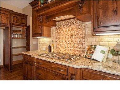 Gas cooktop and detailed tile backsplash