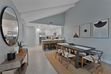 Dining room with visible vents, light tile pattern